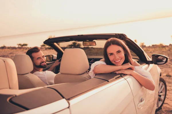 Photo of young couple happy positive smile ride car transport ocean journey seaside honeymoon romantic outdoors — Foto Stock