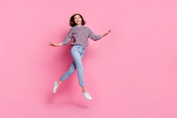 Photo of sweet excited woman wear pullover walking running jumping empty space isolated pink color background — Zdjęcie stockowe