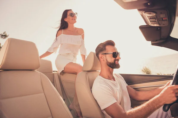 Profile side photo of cheerful couple ride automobile romantic vacation sunny weather weekend outdoors — Stok fotoğraf