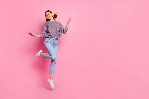 Photo of dreamy sweet woman wear pullover headphones dancing empty space isolated pink color background —  Fotos de Stock