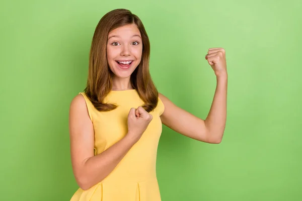 Photo of young cherful lady celebrate success fists hands awesome discount isolated over green color background — Fotografia de Stock