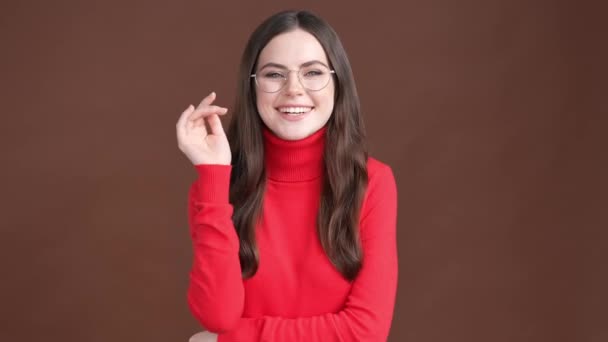 Adorable lady manager enjoy specs isolated brown color background — Stock video