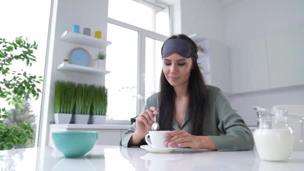 Lady awakening feel positive drink tasty latte in modern kitchen — Vídeo de Stock