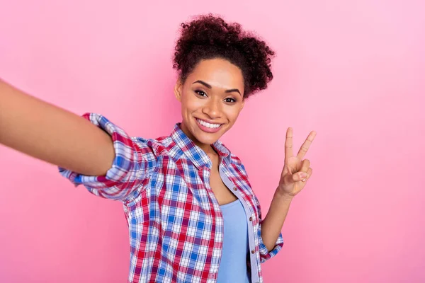 Photo of cool curly hairdo lady do selfie v-sign wear checkered shirt isolated on pink color background — Stock fotografie
