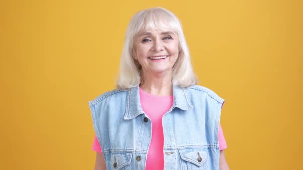 Aged lady enjoy laugh wear waistcoat isolated bright color background — Stockvideo