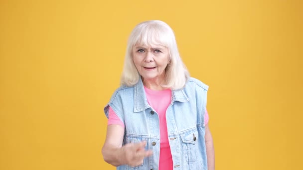 Aged lady in waistcoat watch finger you point isolated shine color background — Wideo stockowe