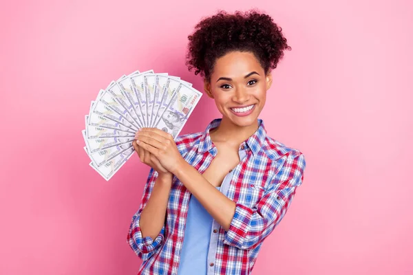 Photo of cute brunette lady hold money wear plaid shirt isolated on pink color background — ストック写真