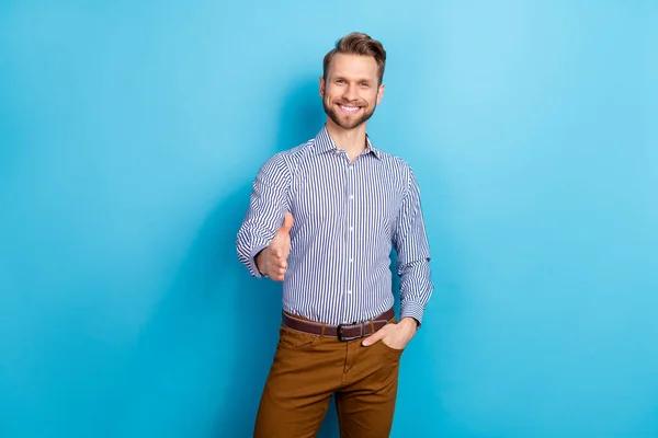 Portrait of positive cheerful man raise arm camera you handshake isolated on blue color background — 스톡 사진