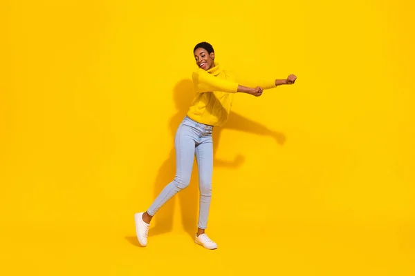 Full length body size view of attractive cheerful thin dreamy girl dancing good day isolated over bright yellow color background — 스톡 사진