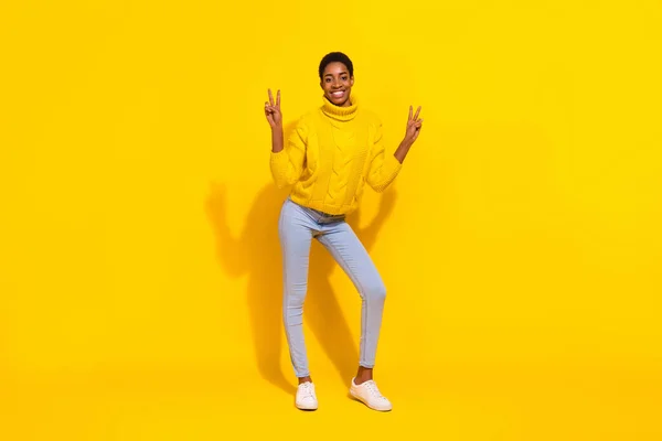 Full length body size view of attractive cheerful slender trendy girl showing double v-sign isolated over vivid yellow color background — Fotografia de Stock