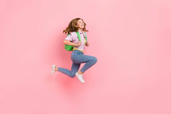 Profile photo of active carefree lady jump rush back to school wear bag jacket isolated pink color background — Photo