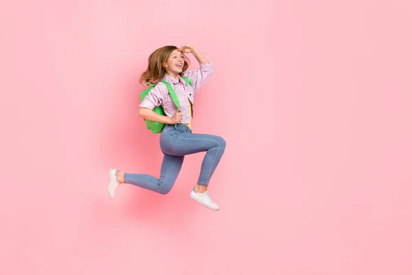 Profile photo of excited curious lady jump look empty space wear rucksack jacket isolated pink color background — 스톡 사진