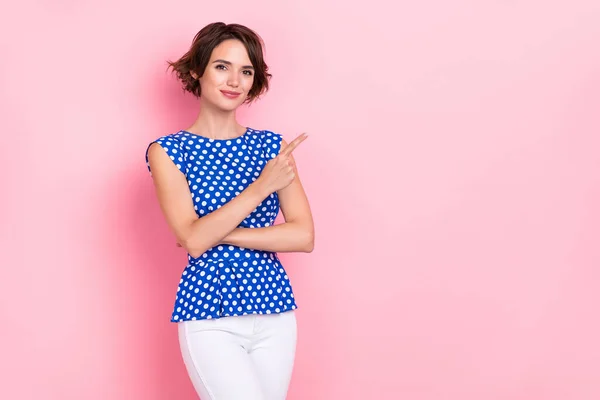 Photo of sweet millennial brunette lady index promotion wear blue top jeans isolated on pink color background — ストック写真