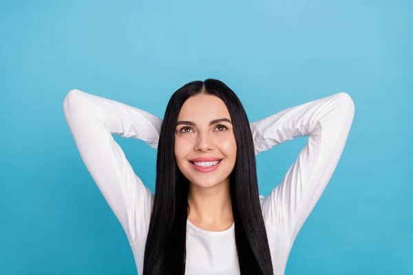 Photo of pretty brunette millennial lady hands head look up wear outfit isolated on blue color background — Stockfoto