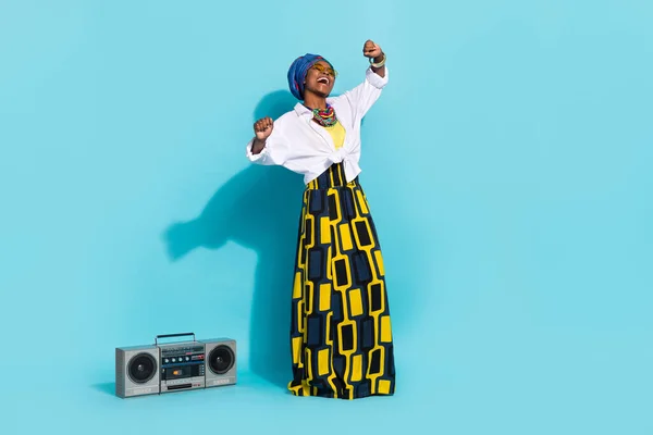 Photo of zulu lady enjoy aborigine song sound dance boom box wear tradition outfit isolated teal color background — Zdjęcie stockowe