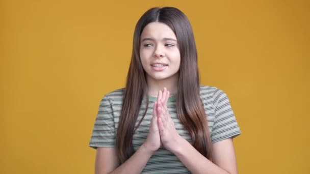 Anxious schoolchild pray pass test lesson isolated vivid color background — Vídeos de Stock