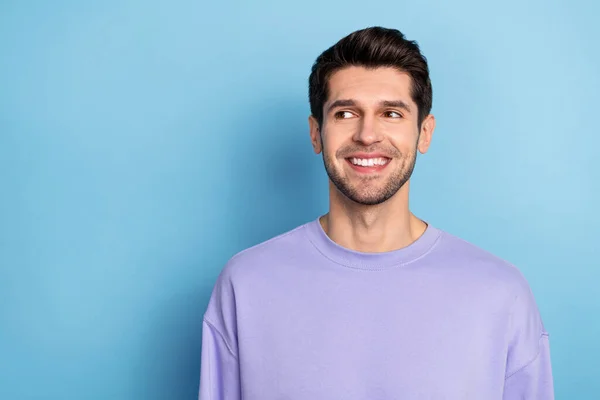 Photo of funny young brunet guy look promo wear sweatshirt isolated on blue color background — Stockfoto