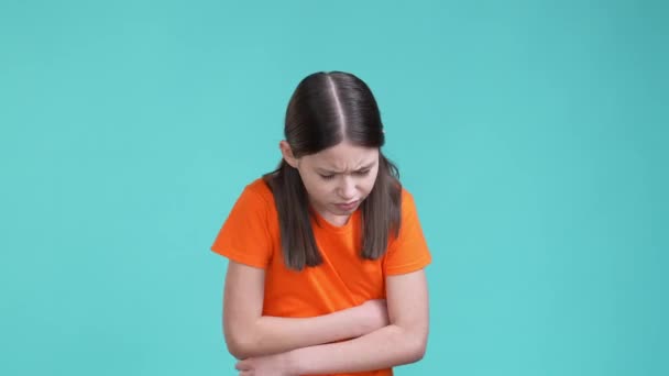 Schoolkid suffer terrible belly abdomen pain isolated cyan color background — Stock Video