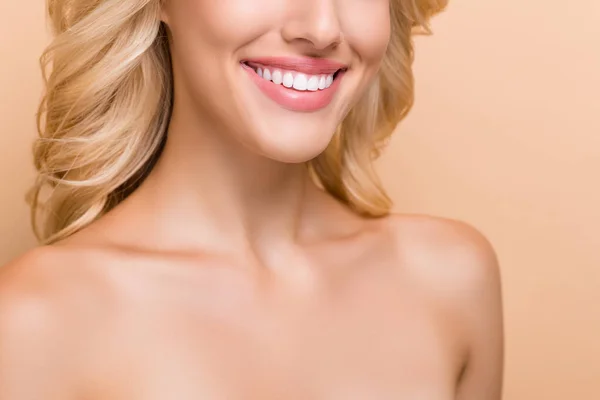 Cropped view portrait of attractive cheerful wavy-haired woman perfect implant teeth isolated over beige pastel color background — Zdjęcie stockowe