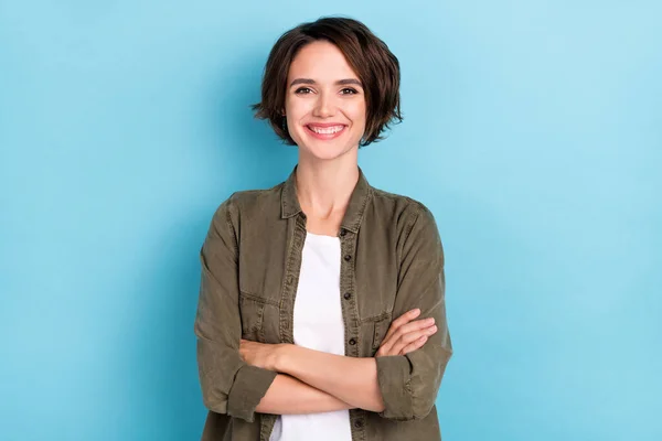 Photo of cute millennial short hairstyle lady crossed palms wear trend cloth isolated on blue color background — ストック写真