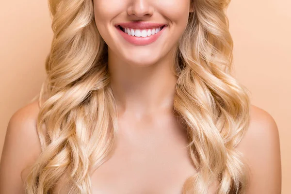 Cropped view portrait of attractive cheerful wavy-haired girl modern aesthetic veneers isolated over beige pastel color background — Photo