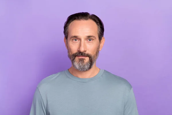 Portrait of good looking positive male in grey color pullover visit barbershop skincare isolated on purple color background — ストック写真