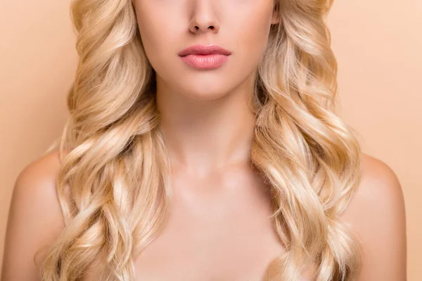 Cropped view portrait of attractive serious healthy wavy-haired girl lips shape aesthetic isolated over beige pastel color background — Zdjęcie stockowe