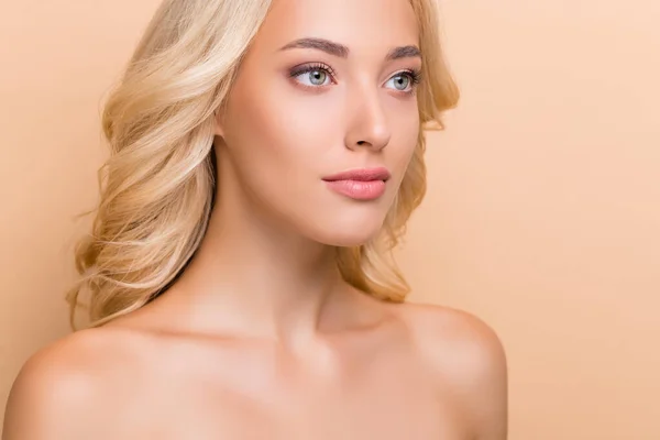 Cropped view portrait of attractive perfect wavy-haired girl flawless makeover isolated over beige pastel color background — Stockfoto