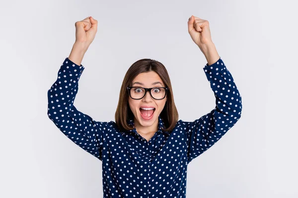 Portrait of attractive cheerful amazed lucky girlish girl rejoicing having fun isolated over gray pastel color background — Stockfoto