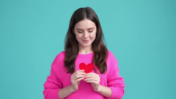 Positive lady share small heart feelings you isolated cyan color background — Stock Video