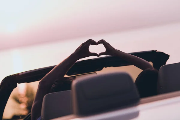 Photo of attractive pretty husband wife wear casual clothes riding cabriolet showing fingers heart outside countryside — Stock Photo, Image