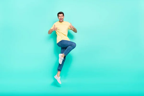 Full body photo of excited cheerful person two hands show thumb up isolated on turquoise color background — 스톡 사진
