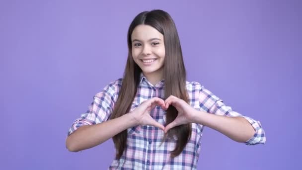 Schoolkid make heart symbol hands send air kiss isolated shine color background — Vídeo de Stock