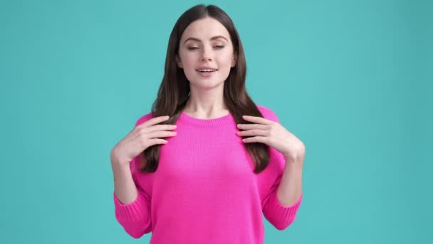 Positive lady enjoy her look meeting new outfit isolated cyan color background — Video