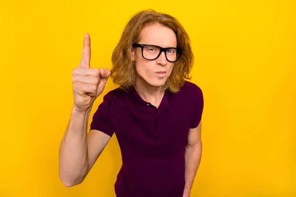 Photo of sad young red hairdo guy index wear eyewear purple polo isolated on yellow color background — Stockfoto
