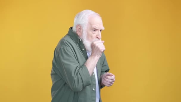 Aged man suffer terrible cough influenza isolated vibrant color background — Stock Video