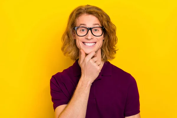 Portrait of cheerful nice person arm touch chin beaming smile isolated on yellow color background — Stockfoto