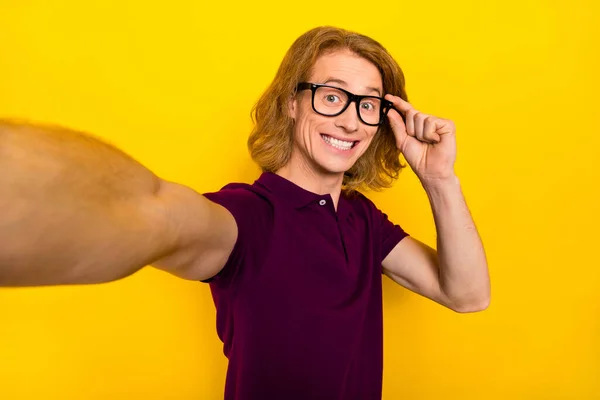 Portrait of cheerful person hand touch eyewear make selfie record video isolated on yellow color background — Stockfoto