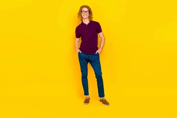 Full length portrait of cheerful glad person put arms pockets toothy smile isolated on yellow color background — Foto Stock