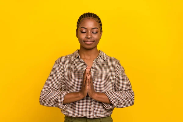 Photo of dreamy charming lady dressed checkered shirt practicing yoga closed eyes isolated yellow color background — Foto Stock