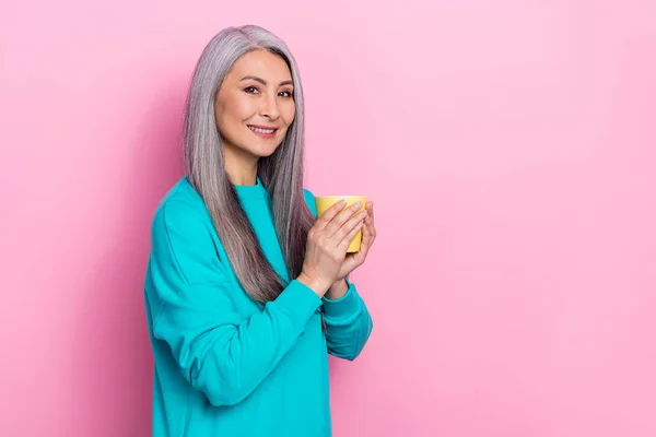 Portrait of cheerful pretty person hold coffee mug toothy smile look camera isolated on pink color background — Stockfoto