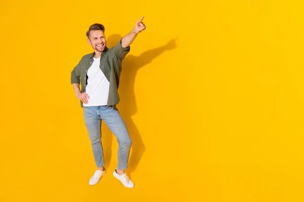 Full length body size view of attractive cheerful guy dancing moving spend evening isolated over bright yellow color background — Foto de Stock