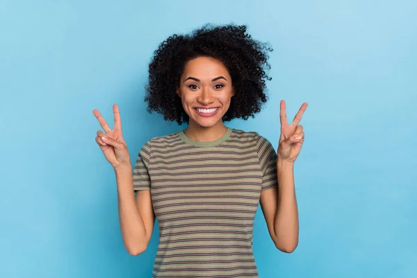 Photo of positive cheerful lady enjoy weekend make v sign symbol isolated on sky light color background — Foto Stock