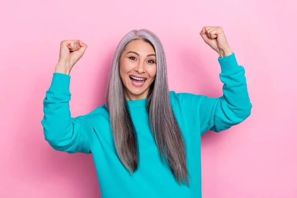 Photo of delighted cheerful person raise fists triumph luck isolated on pink color background — Stock Fotó