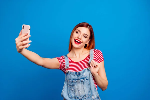 Photo of pretty funky young lady dressed denim clothes tacking selfie modern gadget isolated blue color background — Foto de Stock