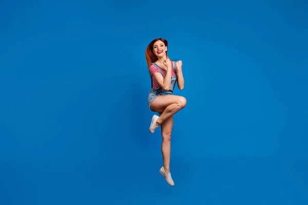 Full size photo of overjoyed lady jumping raise fists celebrate luck isolated on blue color background — Stock Photo, Image