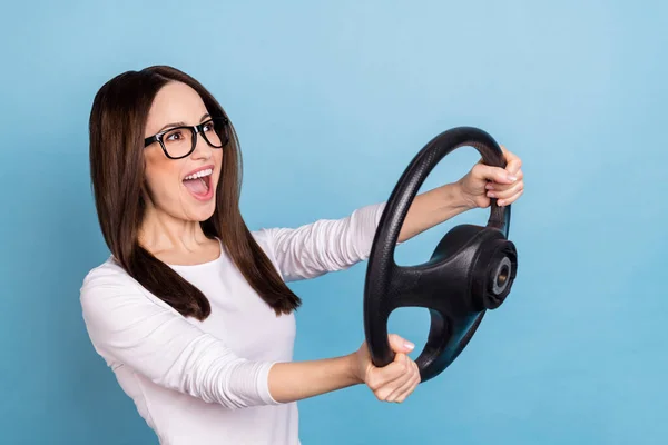 Photo of impressed mature brunette lady drive car look up wear eyewear white shirt isolated on blue color background — Stok fotoğraf