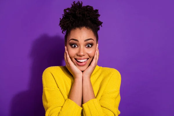 Portrait of funky excited person arms touch cheeks stare speechless isolated on purple color background