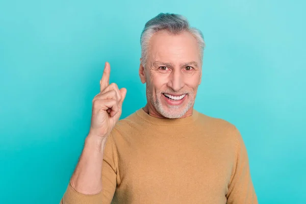 Photo of candid cheerful creative man point finger excellent choice isolated on teal color background — ストック写真