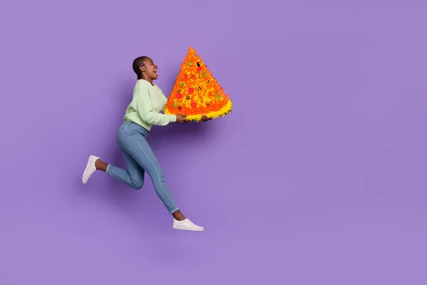 Full size profile side photo of positive overjoyed young lady excited to see huge pizza isolated on violet color background — Stock Fotó